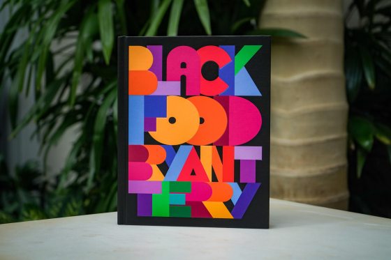 A book entitled Black Food: Stories, Art, and Recipes from Across the African Diaspora proped on a white table